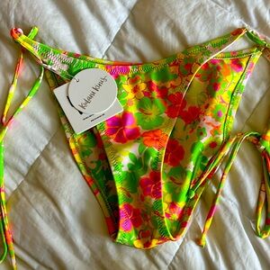 Tie sides, neon tropical flowered bottoms. Full coverage